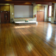 Polished hardwood floors inside the village hall
