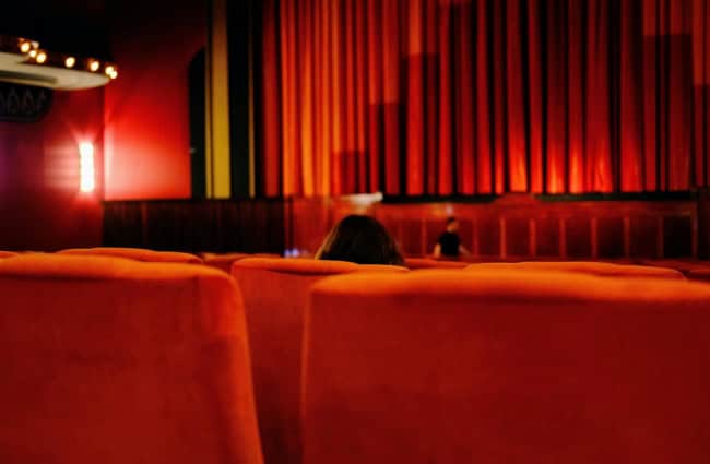 A person sitting in a cinema